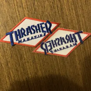 Thrasher logo tygmärke