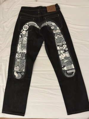 Evisu Jeans - Evisu i nyskick med mechanical design  29x34 går att gör ett trade också