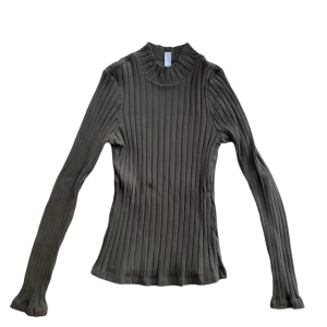 MÖRKGRÖN POLO - Mörkgrön polotröja med lång ärm. 