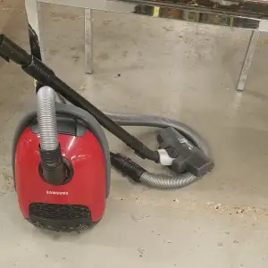 A wheeled portable vacuum cleaner