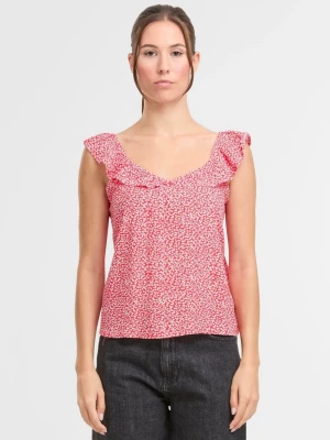Rosa blommig linnetopp med volang - Söt rosa linnetopp med små vita blommor och volangdetaljer vid axlarna. Toppen har v-ringning och är ärmlös, perfekt för varma dagar. Lätt och luftig modell som ger en avslappnad men uppklädd look.❤️