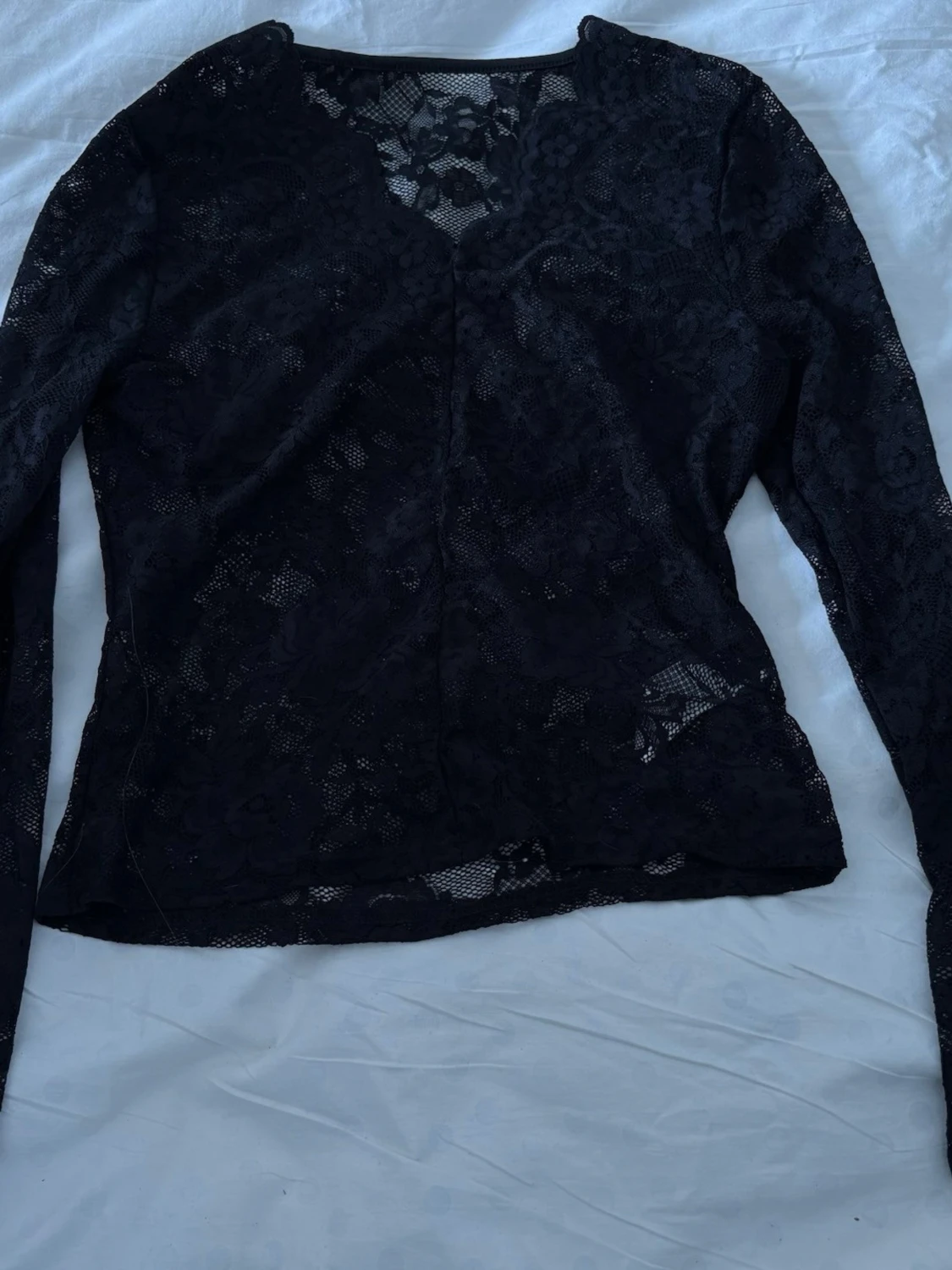 Svart spetsblus med lång ärm