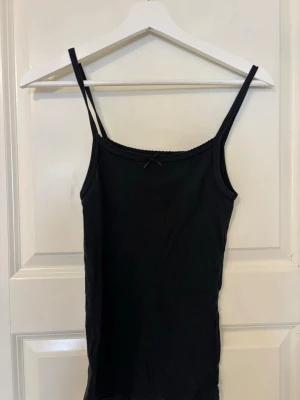 Brandy Melville linne  - Brandy linne med en rosett