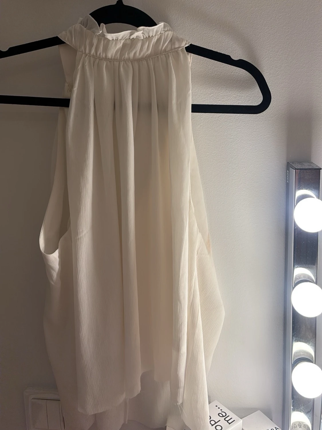 Vit ärmlös blus från H&M