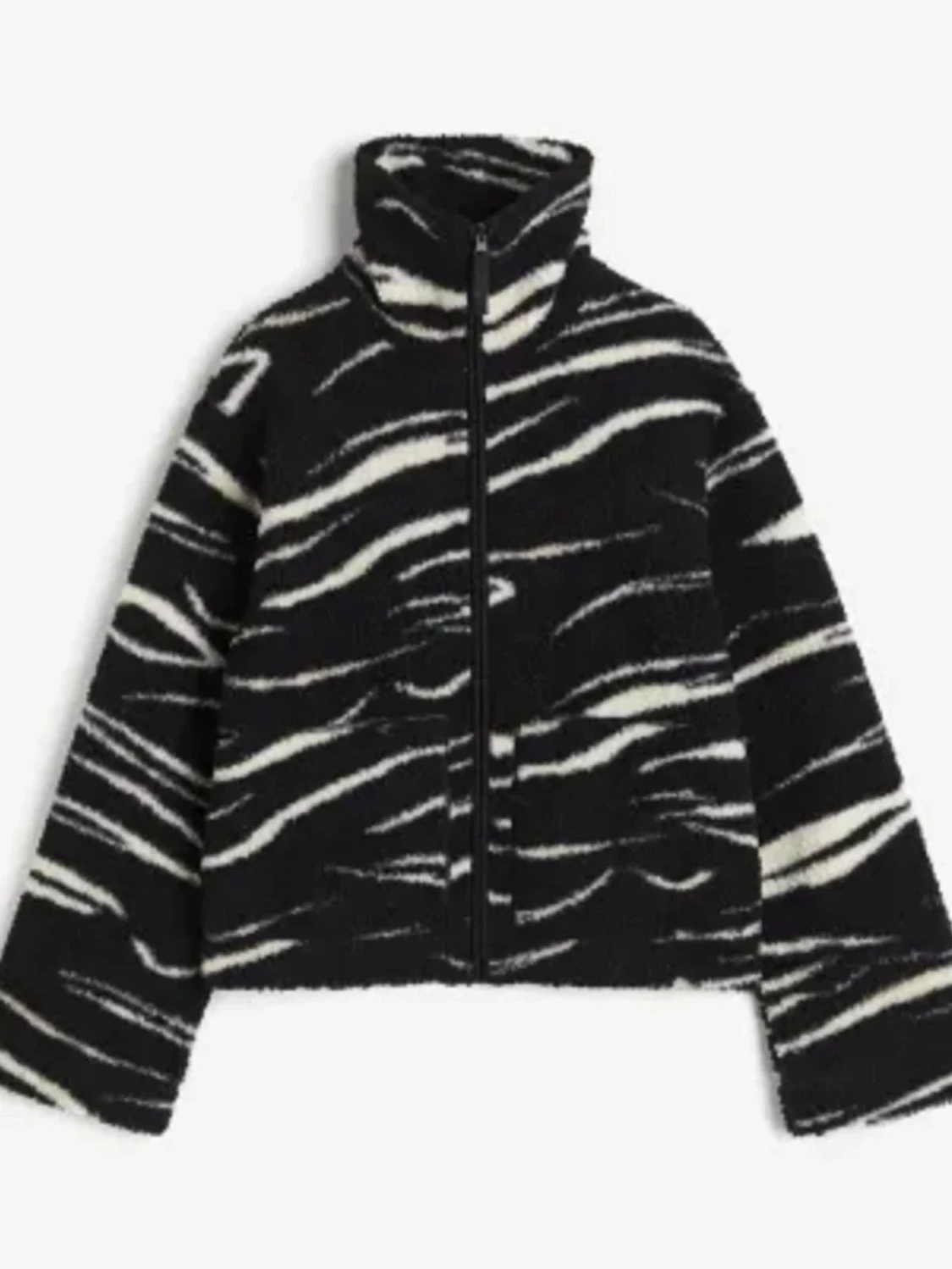 Svartvit teddyjacka med zebramönster från hm