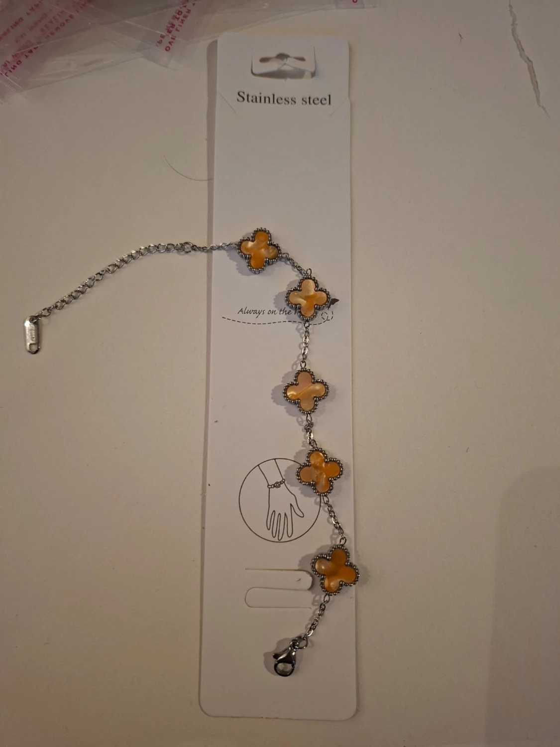 Armband i rostfritt stål med gula blommor