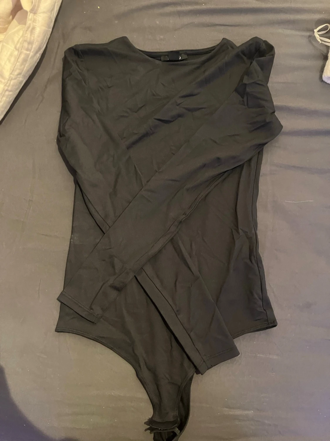 Svart långärmad body från Amisu