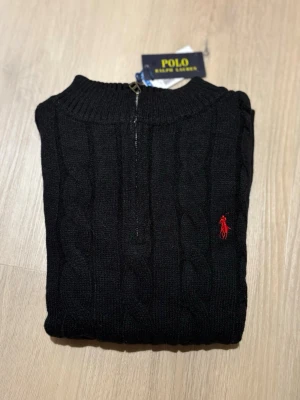 Polo Ralph Lauren Quarter Zip - Brand new Polo Ralph Lauren Quarter Zip sweater for sale. Perfect for autumn and winter wear. Classic black shade with the iconic embroidered logo on the chest 🐎 (measurements can be found in the pictures!)  🔹 Brand: Polo Ralph Lauren 🔹 Color: Black 🔹 Model: Quarter Zip 🔹 Condition: Brand new with tags ✨ 🔹 Size: S  Perfect for a clean, smart, and polished look 👌 📦 Fast shipping | 💬 Feel free to ask for more information