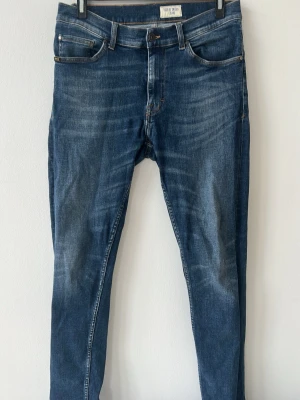 Tiger of Sweden jeans  - Tjena, säljer ett par schyssta tiger of sweden jeans i modellen Evolve, i strl W32/L32 Jeansen är i färgen blå och är i ett bra skick hör gärna av dig om du har några frågor🤗13