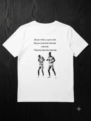 T-shirt 🎶 Eu Quero Tchu Tcha Tcha Graphic Print - This white short-sleeve t-shirt features a unique black and white graphic print of two dancing figures, accompanied by lyrics from the popular Brazilian song "Eu quero tchu, eu quero tcha." Made from 100% polyester, it offers a comfortable and lightweight feel.  ⭐️ Condition : 9/10 🎲 Size : XS 🎨 Color : White 📦 Fast and careful shipping