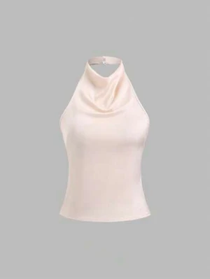 Fest topp! - En väldigt snyggt silkes likt material med snören man knyter på ryggen och krage man knäpper där bak. Aldrig använd bara testad!