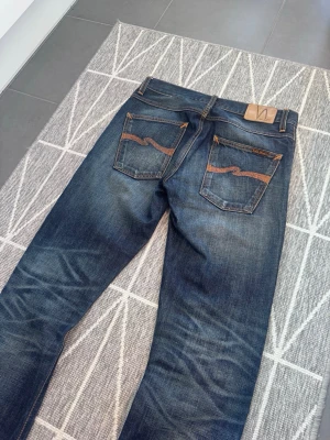 Nudie jeans grim tim lab tim vintage archive rare  - Nudie jeans lab tim, selvedge selvage jeans. Från 2009-2012. Riktigt sällsynt tillverkas inte längre. w31/30. Får mått eller något skriv privat. Riktigt snygga rare nudies 