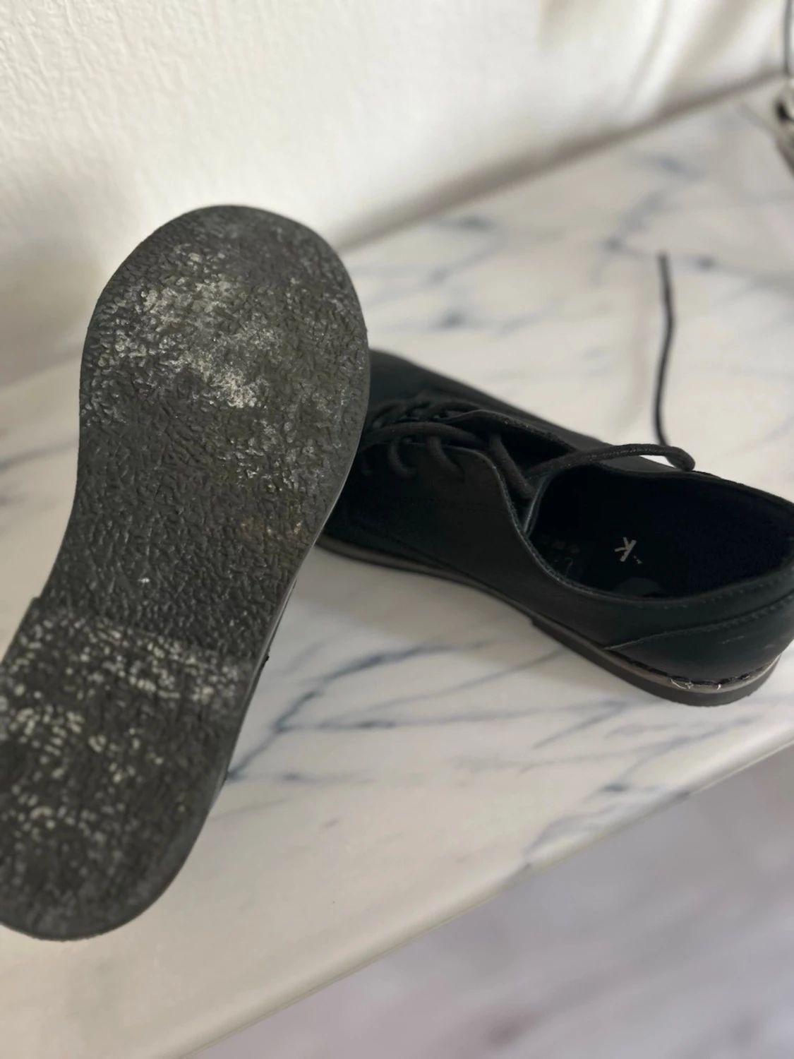 Svarta loafers med snörning