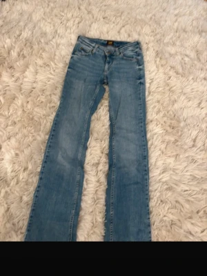 Lee jeans - Lågmidjade bootcut jeans från Lee, aldrig använda, storlek 24/31