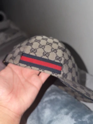Gucci keps gråblå - Gucci keps till salu då den ej används längre box o kvitto finns inte.