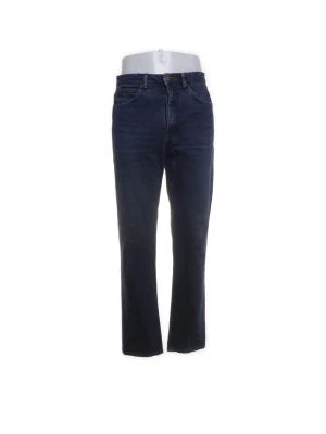 Edwin mörkblå raka jeans - Snygga mörkblå Edwin jeans med rak passform och klassisk femficksdesign. Jeansen har hög midja och stängs med knapp och dragkedja. Perfekta för en avslappnad och stilren look.