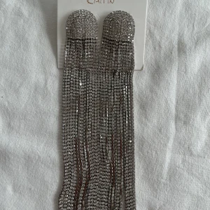 Öronhanga - Oanvänd öronhanga 