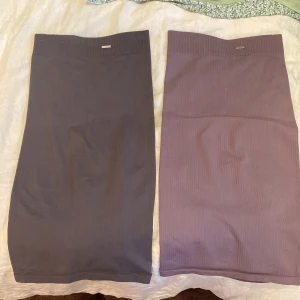 Aimn kjol , pennkjol  - 2 st aimn kjolar, pennkjol. Sitter jätte snyggt på. Storlek xs 