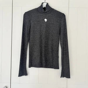 Reinders topp glitter glittrig  - Glittrig top från Reinders stl M 