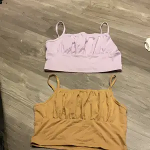 En brun och en lila croptop i skönt material Säljer pga för stor och inte min stil