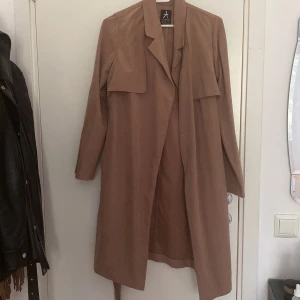 Trenchcoat  - Oanvänd