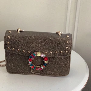 Väska Steve Madden  - Fin steve Madde väska helt ny oanvänd Guld glitter disco 