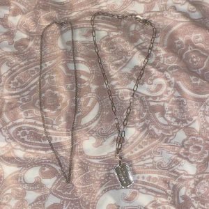 Halsband  - Ett silver halsband + kedja för endast 30kr. Aldrig använt