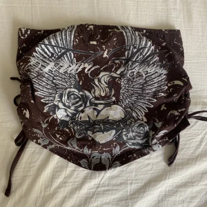 Bandeau topp - Jätte snygg bandeau top från Urban outfitters med snörning på sidorna. Aldrig använd och är i storlek S