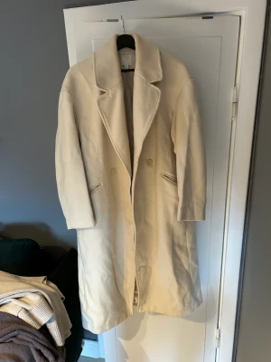 Ljusbeige kappa  - Fin kappa frpn H&M. 