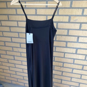 Svart bodycon klänning  - Svart bodycon klänning från bikbok, i nytt skick med prislapp på.