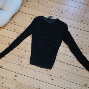 Jean paul gaultier long sleeve top - Long mesh sleeve top with flocked all over print. Second hand designer. Condition good