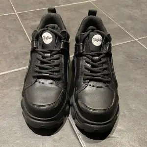 • Black Buffalo Sneakers/Boots • Barely used with a small scuff on the front of the left shoe as seen on the pictures • EUR 37, US 6 1/2, UK 4  • Peta-Approved Vegan Leather 
