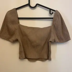 Light brown summer tee with no tears or cuts only worn twice 