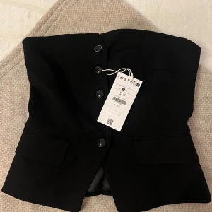 Korsett - Korsett i ”kavaj”, aldrig använd, storlek s