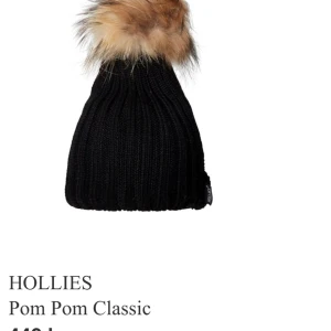 Mössa från hollies - Mössa med pälsboll från märket hollies, aldrig använd