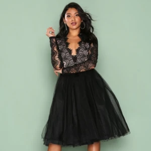 Black dress  - A black party dress. It's a long sleeve lace tutu dress black size EU 38. It is very elegant and classy and also very comfortable. It brand new and still has the tag on.