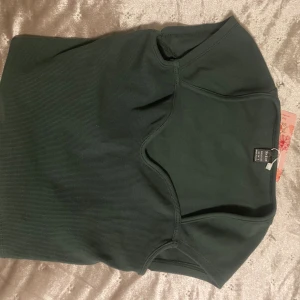 grön topp - grön topp, oanvänd lappen kvar