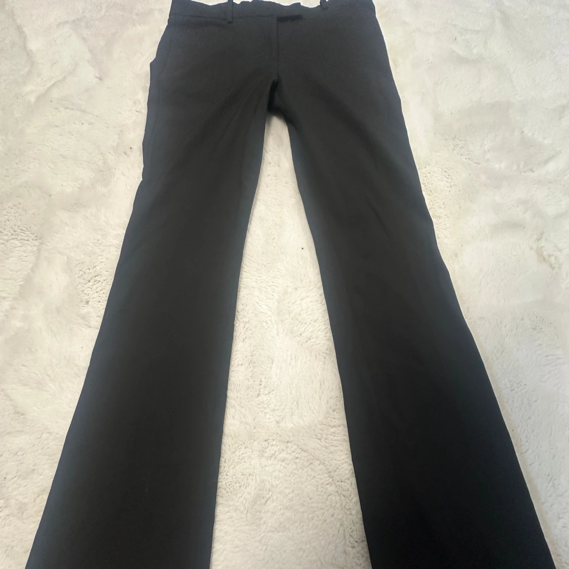 Lågmidjade svarta kostymbyxor