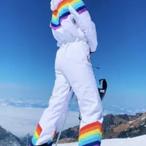 Retro-style ski suit / overall by OOSC (brand) in Women’s size XS. New with tags.  https://eu.oosc-clothing.com/products/rainbow-road-womens-ski-suit