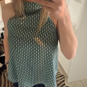 Topp - Jag säljer en jätte cool o snygg Green Coast topp som jag inte använder. Den är knappt använd.