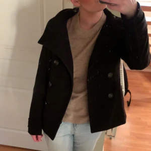 Kappa - Fin svart kappa som inte passar mig längre. Priset är diskuterbart. Den sitter som en XS-S