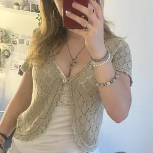 Coquette lacy button short sleeve cardigan. Beige with sparkles. Only worn once or twice, no signs of wear. Selling because it’s no longer my style.