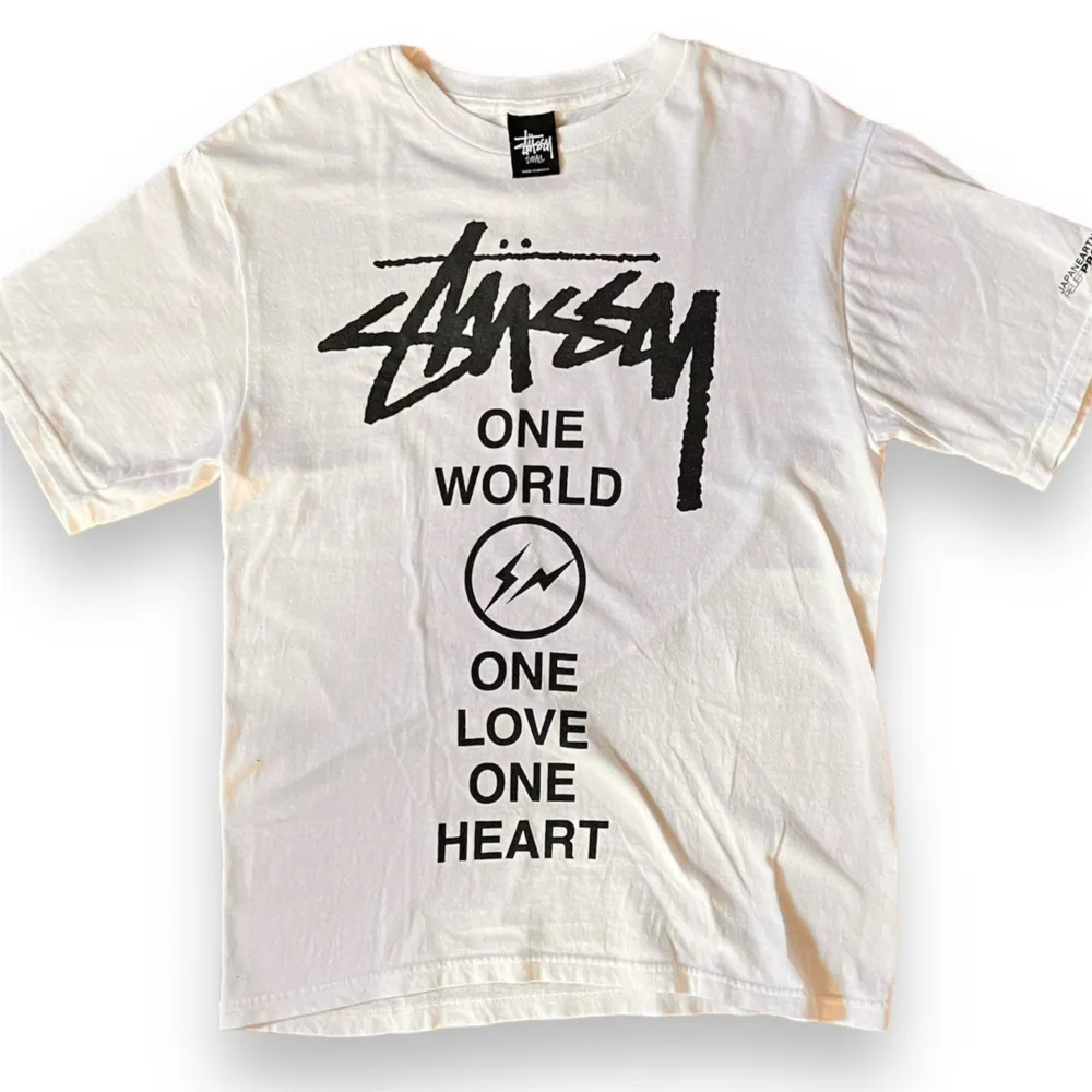 STUSSY Fragment collab T-shirt   Size: S  Released in 2011  East Japan Earthquake Charity T-shirt  JAPAN EARTHQUAKE RELIEF PROJECT 2011  Excellent Condition     Measurements Top: Width: 46cm Length: 65cm. T-shirts.