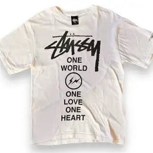 STUSSY Fragment collab T-shirt   Size: S  Released in 2011  East Japan Earthquake Charity T-shirt  JAPAN EARTHQUAKE RELIEF PROJECT 2011  Excellent Condition     Measurements Top: Width: 46cm Length: 65cm