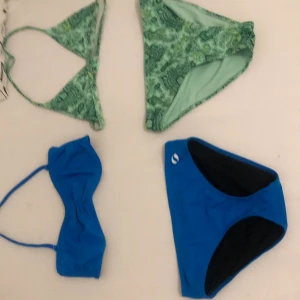 Två bikinis - Den gröna är från Gina i storlek 170 oanvänd kostar originellt 270 den blå i storlek xs kostar orginellt  350