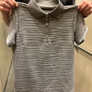 Rönnisch golf piké  - Storlek M Använd 1 gång 