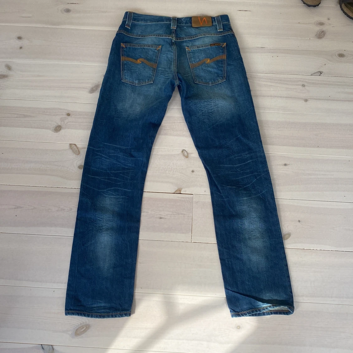 Blåa nudie jeans