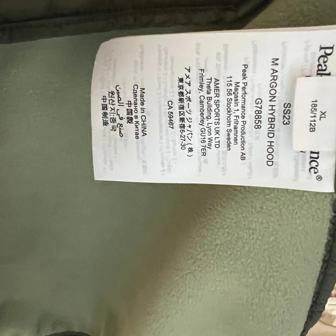 Grön hybridjacka med huva från Peak Performance - 2