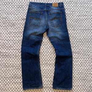 Vintage Nudie RegularRalf - Säljer dessa sjukt feta nudie jeans i modellen RegularRalf, jeansen är i fint skick och är i storleken W34/L32, hör av dig vid funderingar!🙌