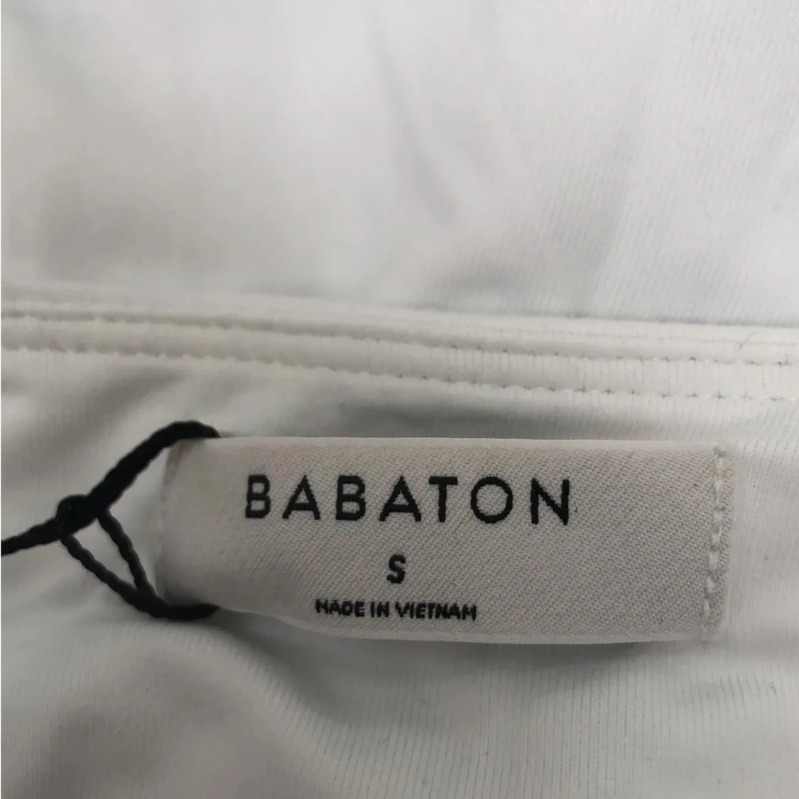 Vit långärmad topp från Babaton - 2